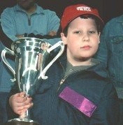 Aaron Joerger holding trophy at TLC Discovery Robotica, 2001